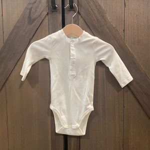 Gray label body suit, never worn. New without tags.